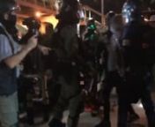 Without any warning, the riot police suddenly assault the citizens in front of them while talking to them.