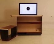 Furniture with shelves and drawer in iron, paduk, mahogany and maple woodsnA lateral switch activates the device bringing the tv to the back of the furnituren©Rota-lab 2013nwww.rota-lab.com