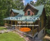 Brimming with lots of recent updates, On the Rocks is ready to host your next Deep Creek Lake vacation! It is in the picturesque Gallatin Woods community that is just minutes from area activities. nnNestled in the woods, this stunning log home has ample space for everyone to make themselves at home. The spacious main level boasts tongue and groove walls, cathedral ceilings, and wide hardwood plank floors. Kick-back on comfortable furnishings in the great room to watch TV. A floor-to-ceiling gas