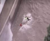 Dramatic aerial footage captured the moment a woman was rescued from a raging LA river.Source: NBC