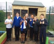 Children at Fieldhead Primary School in Batley thank Wickes for its donation which helped to create an outdoor reading shed.