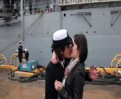 The crowd screamed and waved flags around them.&#60;br/&#62;&#60;br/&#62;Both women, ages 22 and 23 respectively, are fire controlmen in the Navy. They met at training school and have been dating for two years.&#60;br/&#62;&#60;br/&#62;Navy officials said it was the first time on record that a same-sex couple was chosen to kiss first upon a ship&#39;s return. Sailors and their loved ones bought &#36;1 raffle tickets for the opportunity. Gaeta said she bought &#36;50 of tickets.