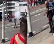 This is the shocking moment a football fan blows his fingers off after lighting a flare outside a stadium in the Netherlands. &#60;br/&#62;&#60;br/&#62;Footage showed the man waving around the pyrotechnic on the street outside the Philips stadium in Eindhoven before it exploded.&#60;br/&#62;&#60;br/&#62;While looking stunned following the loud bang of the misfired flare, he continued as if nothing was wrong.&#60;br/&#62;&#60;br/&#62;Only when blood was dripping down from his hand, the fan seemed to realize what had happened.&#60;br/&#62;&#60;br/&#62;Another video showed that one of his fingers was missing and the man stared at his mangled hand in disbelief as concerned bystanders gathered around him to help. &#60;br/&#62;&#60;br/&#62;The football fan had fired off the flare ahead of the Dutch League final between PSV Eindhoven and Sparta Rotterdam. &#60;br/&#62;&#60;br/&#62;He appeared to be a PSV fan as he was wearing a scarf in the team&#39;s colors, but he likely missed his team&#39;s 4-2 win due to having to seek medical attention.&#60;br/&#62;&#60;br/&#62;On Sunday, his team ended a six-year wait to secure their 25th Eredivisie - the Dutch league - title.&#60;br/&#62;&#60;br/&#62;Needing a point to make sure after a dominant campaign in which they have lost only once in 32 games, PSV fell behind early but rallied to defeat mid-table Sparta.&#60;br/&#62;&#60;br/&#62;&#39;We scored the most goals, conceded the fewest goals and created the most chances. We have shown that we are the best in the Eredivisie, very simple,&#39; player Teze, 24, told Dutch TV station NOS.&#60;br/&#62;&#60;br/&#62;&#39;Six years ago I was watching (from the stands) like everyone else. I hoped then that I would one day be able to experience such a moment myself.&#39;&#60;br/&#62;&#60;br/&#62;There were rapturous scenes at the final whistle as fans waved cardboard replicas of the Dutch league trophy, but remained in the stands after there had been pre-match fears of a pitch invasion.