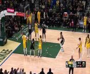 LeBron James celebrates on the sidelines as Giannis misses both free throws at the end of double-OT
